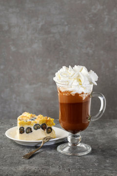 Piece Of Blueberry Cheesecake And Glass Of Irish Coffee