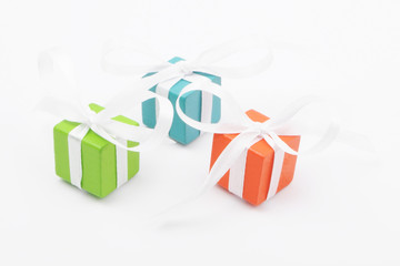 Gifts for Christmas or a birthday - three colourful packages - obrazy, fototapety, plakaty