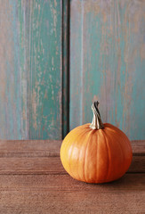 Pumpkin on wooden table, copy space