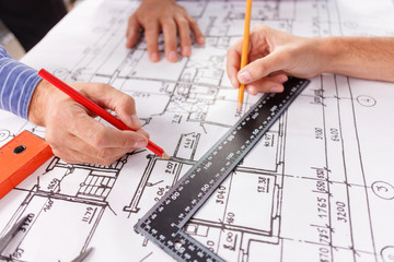 Cheerful male engineers in process of work