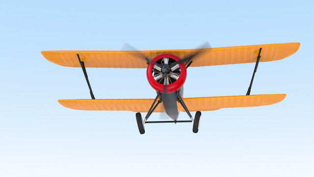 Yellow and black biplane flying in the sky