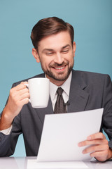 Cheerful male reporter is preparing for speech