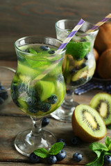 Kiwi and Blueberry cocktails on wooden background