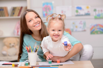 Fototapeta premium Pretty friendly family is faking fun together