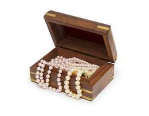 Small wooden chest with white pearl necklace