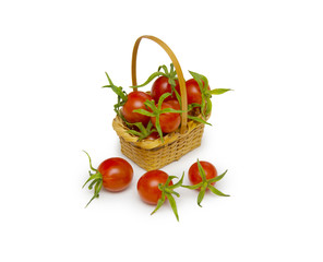 Fresh red tomatoes in basket isolated on white