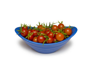 fresh tomatoes with green leaves isolated on white background