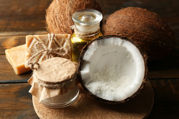 Spa coconut products on dark wooden background