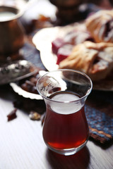 Antique tea-set with Turkish delight and baking on table close-up