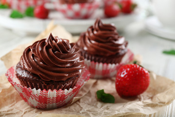 Chocolate cupcakes on craftpaper closeup