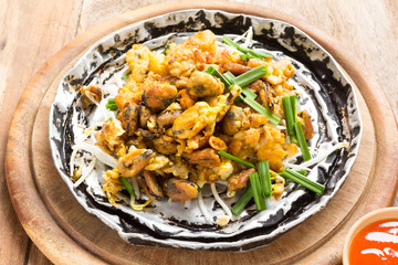 Crisp fried mussel pancake on wood