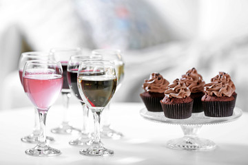Tasting of wine and chocolate cupcakes, close up