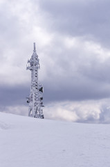 Telecommunications tower on top of a mountain in Florina, Greece, in winter