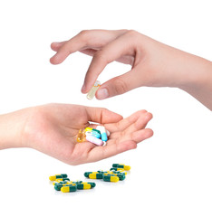 Drug capsules and pills in hand