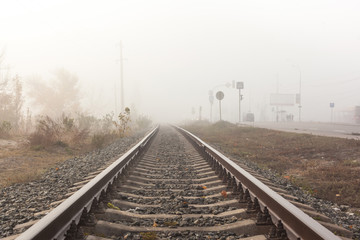 Fototapeta na wymiar Railways at foggy weather morning