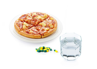 Pizza on the plate with Drug capsule and drinking water on white