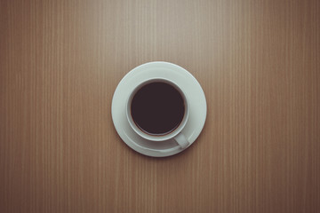 Vintage tone of Coffee cup top view on wooden table background