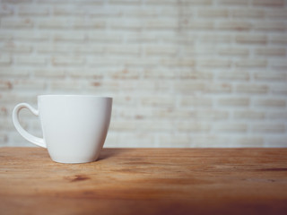 Coffee cup in coffee shop - vintage style effect picture