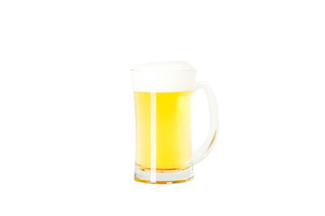 Light beer with a foam in transparent mug isolated on white background studio shot with clipping path