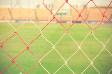 Fototapeta premium blurry football and soccer goal net pattern vintage color