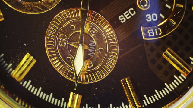 extremly close-up of gold watch timelapse 4k (4096x2304)

