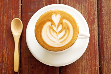 Hot coffee in a white cup on table