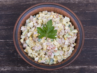Russian traditional salad olivier with pea in the plate