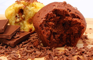 Fresh baked muffins, grated and portion of chocolate