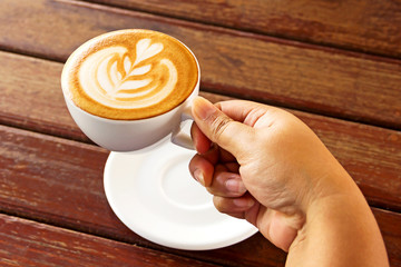 drinking a cup of hot coffee Latte