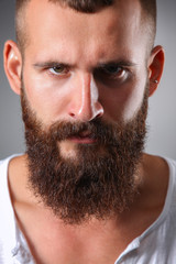 Obraz premium Portrait of handsome man standing, isolated on grey background