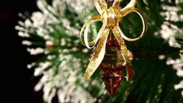 Unusual decoration - a crystalline toy on christmas tree, bokeh, light, black, garland