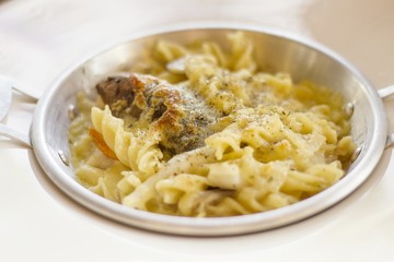 Pasta bake with whole wheat penne, - Tasty Italian seafood
cheese and seafood - close up - Italian cuisine.