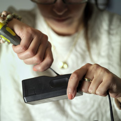 Woman Fixing Appliance