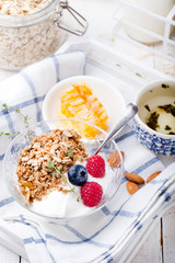 Healthy breakfast. Granola with pumpkin seeds, honey, yogurt, fresh berries .