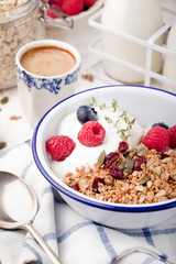 Healthy breakfast. Granola with pumpkin seeds, honey, yogurt ,fresh berries.