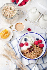 Healthy breakfast. Granola with pumpkin seeds, honey, yogurt ,fresh berries.