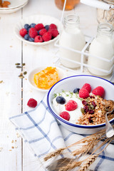 Healthy breakfast. Granola with pumpkin seeds, honey, yogurt ,fresh berries.