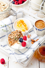 Healthy breakfast. Granola with pumpkin seeds, honey, yogurt, fresh berries .