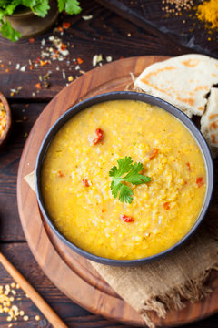 Red lentil Indian soup with flat bread. Masoor dal. 