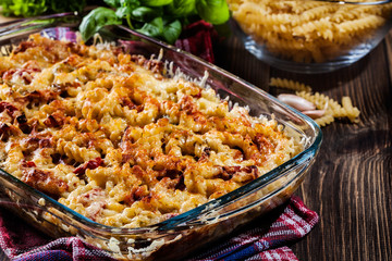 Casserole fusilli pasta with sausage, zucchini and cheese