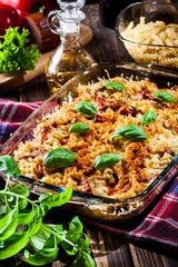 Casserole fusilli pasta with sausage, zucchini and cheese