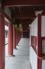 Red pillars with shadow at Shitennoji temple in Osaka.