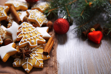 Cookies with spices and Christmas decor, on wooden table