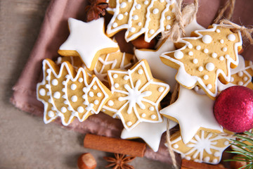 Cookies with spices and Christmas decor, on wooden table