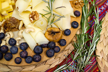 Still life picture with cheese and rosemary