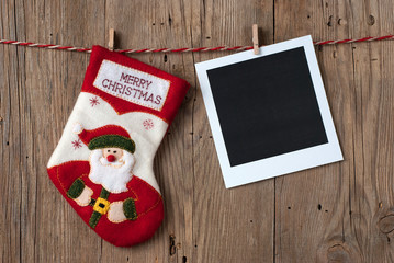 Christmas decoration with instant photo on old wooden background
