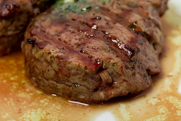 Grilled steak with green butter.