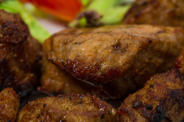 Delicious lamb shish kebab with tomatoes.