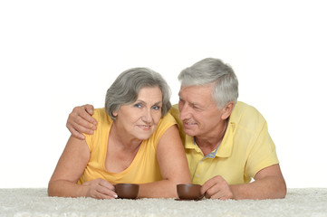  Old couple with cups of coffee