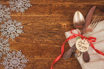 Christmas table place setting with christmas pine branches, ribb